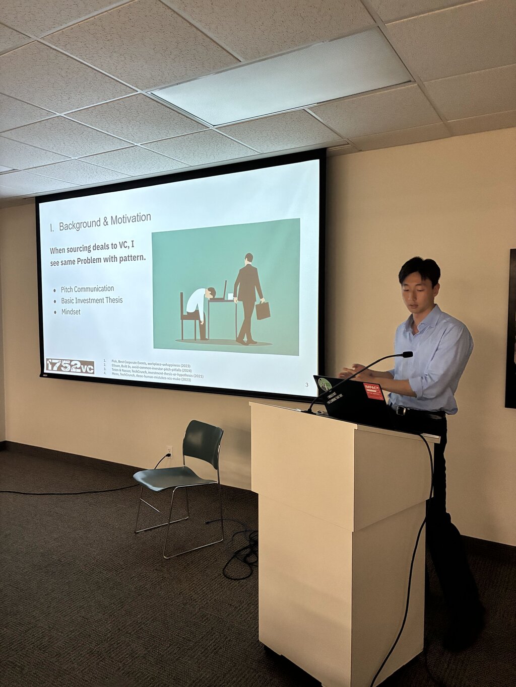 Founder presenting to an audience at an event
