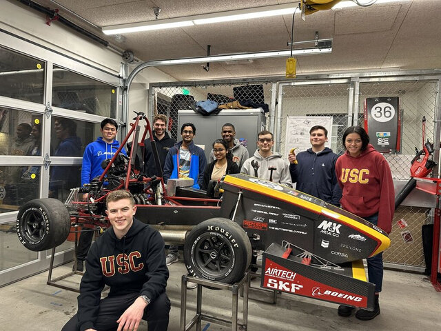 A student engineering team with their build
