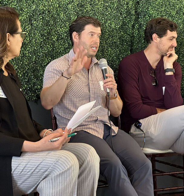 Investors speaking with founders on a panel