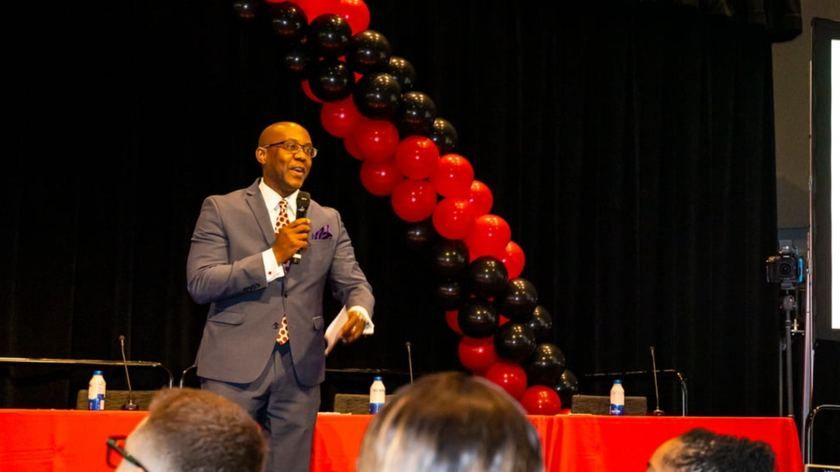 A speaker giving opening remarks at CSUN