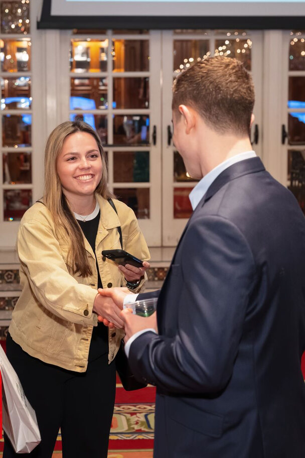 Founders and investors meeting at a showcase reception