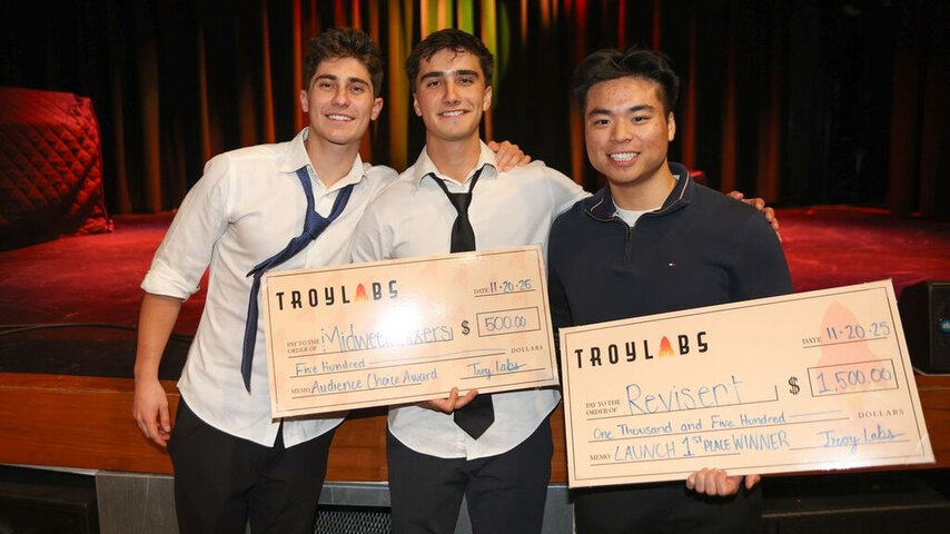 Graduates with their competition winnings