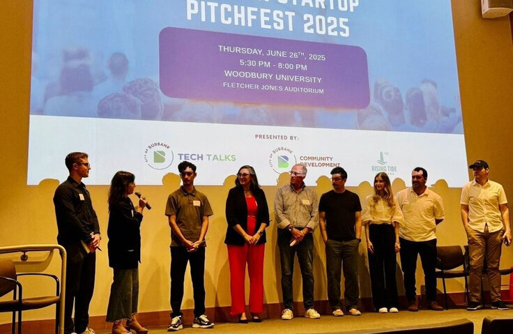 Launchpad founders on stage at a pitch night